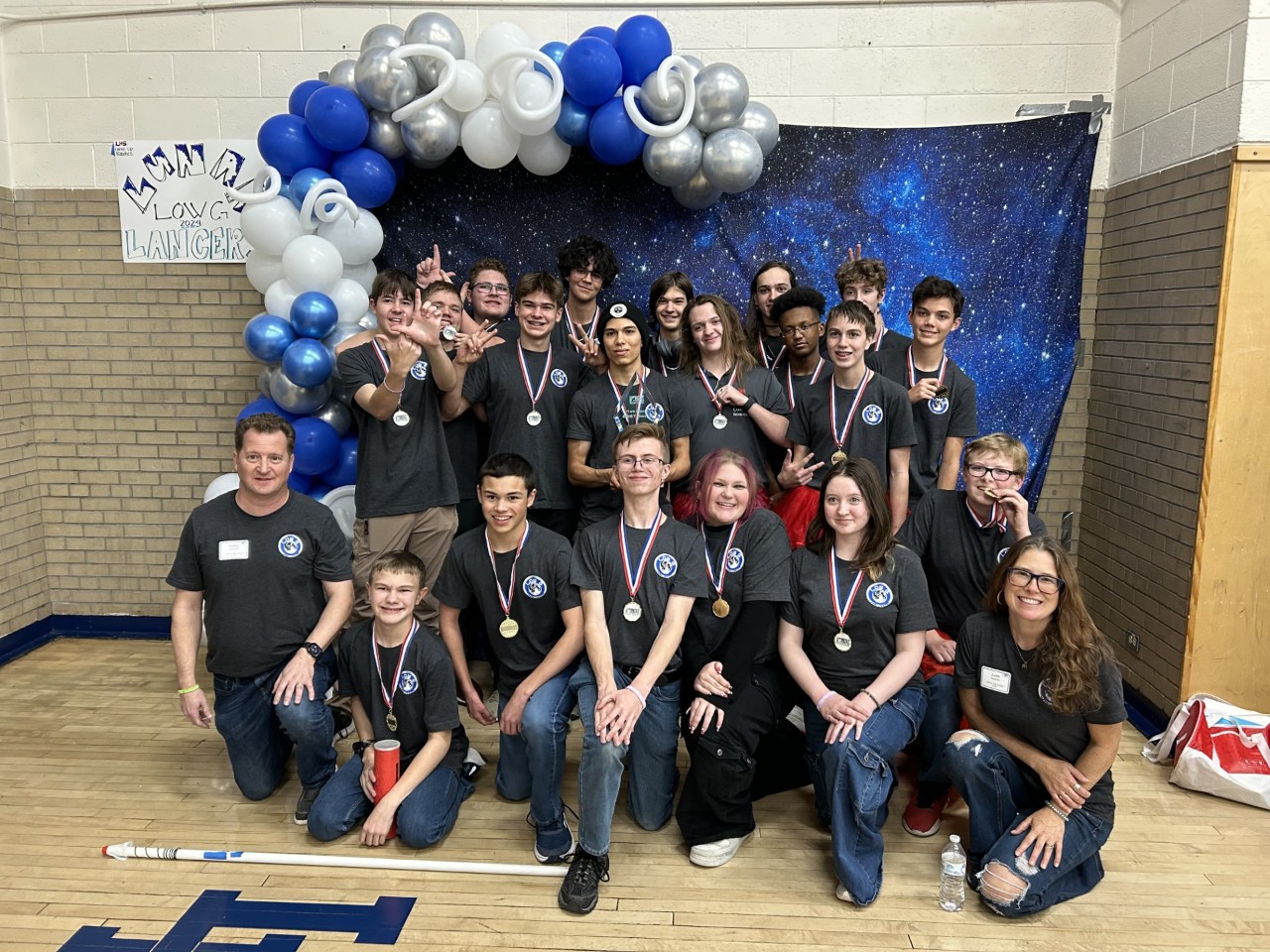 The Robotics team poses after winning 1st place at the BEST competition.